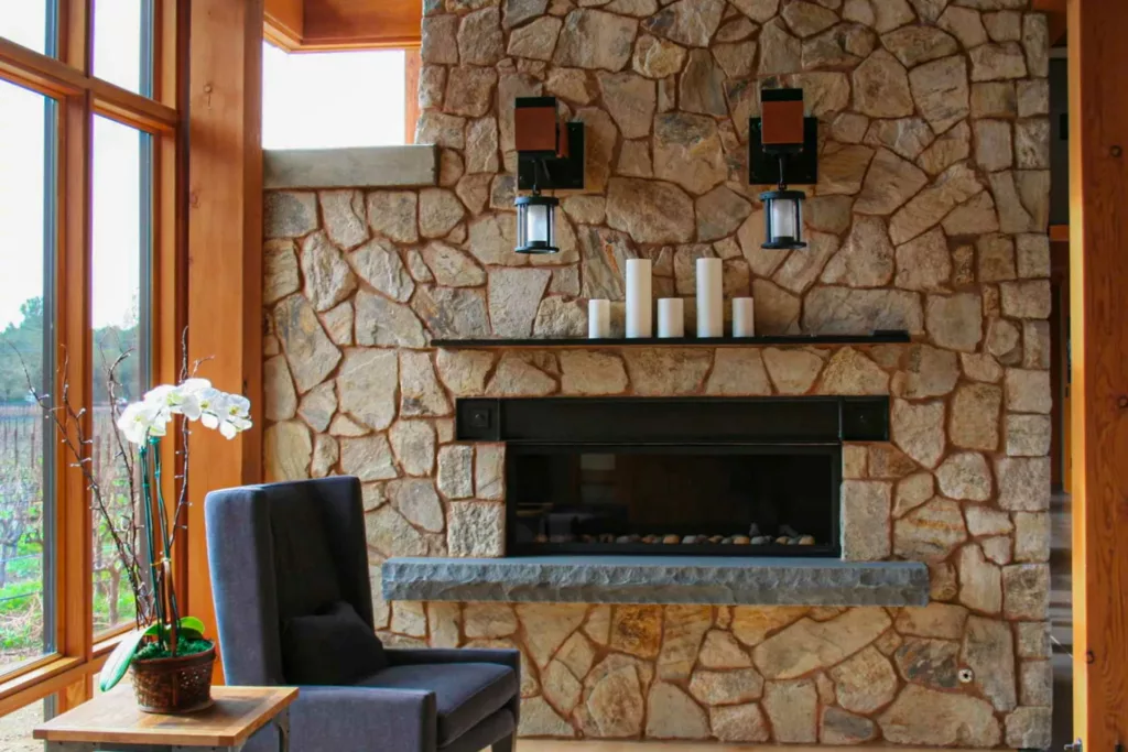 hand-cut stone fireplace by Masonry by Conrad overlooking a vineyard in the heart of Sonoma County