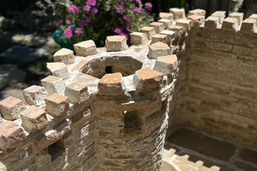 backyard miniature castle for richard conrad's daughter made from stone and masonry